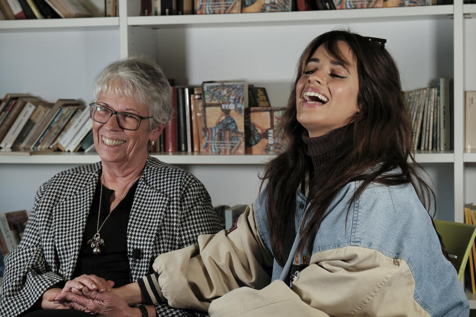 Cuban-born American singer and songwriter Camila Cabello, right, poses with her grandmother, Mercedes Rodriguez, during and interview for the Associated Press in Malaga, Spain, Thursday, March 23, 2023. When she's not singing or dancing, Cabello likes to support members of her family such as Rodriguez, who has recently published her debut novel in Spanish titled "Los boleros que he vivido". (AP Photo/Gregorio Marrero)