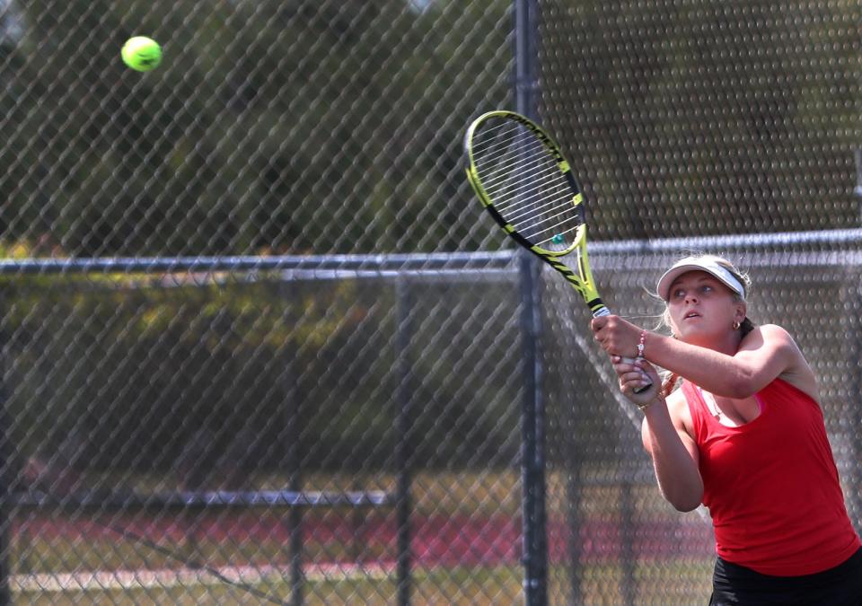 New Smyrna Beach's Ava Epps hits a backhand shot against Edgewater during the Region 3-3A semifinals, Tuesday, April 23, 2024, at New Smyrna Beach High School.