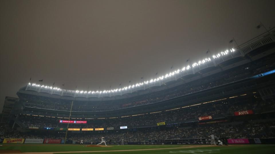 New York Yankees starting pitcher Clarke Schmidt (36) pitches against Chicago White Sox shortstop Tim Anderson (7) during the first inning at Yankee Stadium.