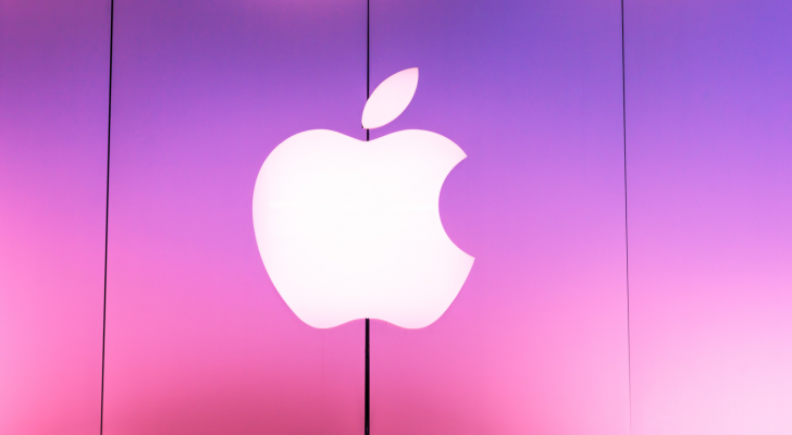 Apple logo on a pink and purple background. AAPL stock.