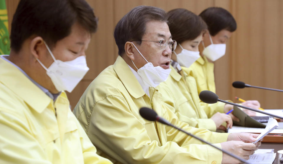 South Korean President Moon Jae-in, second from left, speaks during a special government meeting to discuss measures to prevent the further spread of COVID-19 at the Daegu City Hall in Daegu, South Korea, Tuesday, Feb. 25, 2020. China and South Korea on Tuesday reported more cases of the new viral illness that has been concentrated in North Asia but is causing global worry as clusters grow in the Middle East and Europe. (Han Sang-kyun/Yonhap via AP)