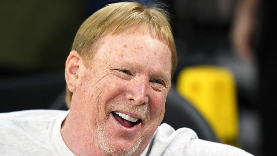 Raiders owner Mark Davis can be seen here having a laugh during a conversation.