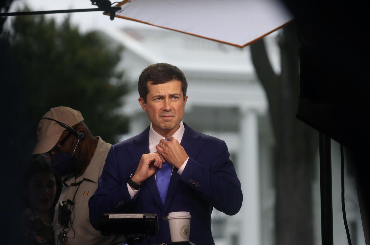 U.S. Secretary of Transportation Pete Buttigieg prepares to give a live interview to the news media outside of the White House in Washington, U.S., October 13, 2021. (Leah Millis/Reuters)