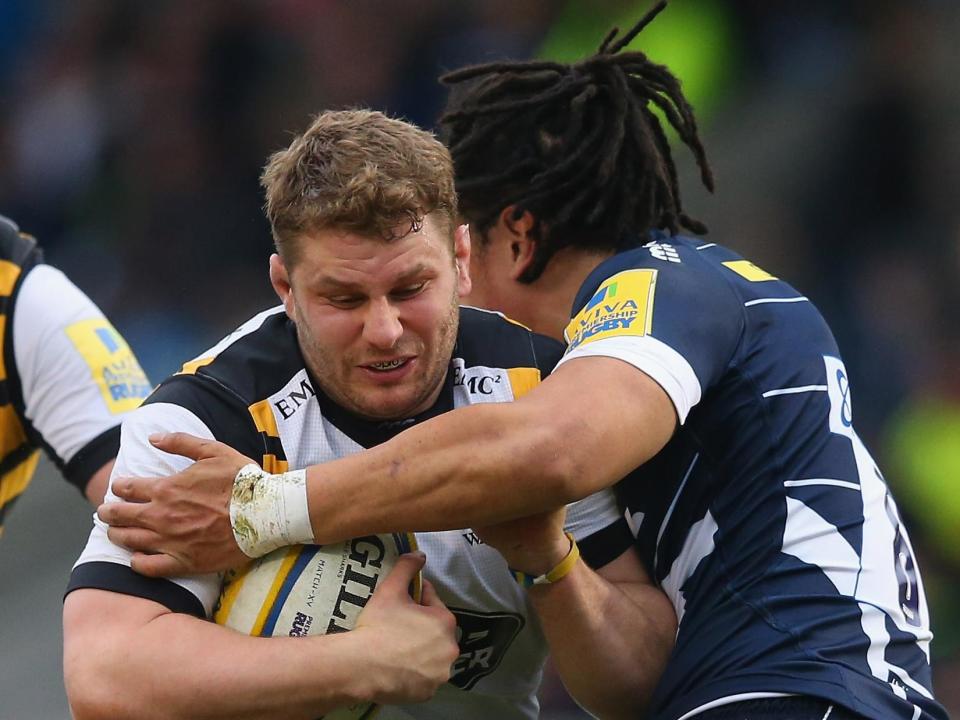 Thomas Young of Wasps is tackled by TJ Ioane (Getty Images)