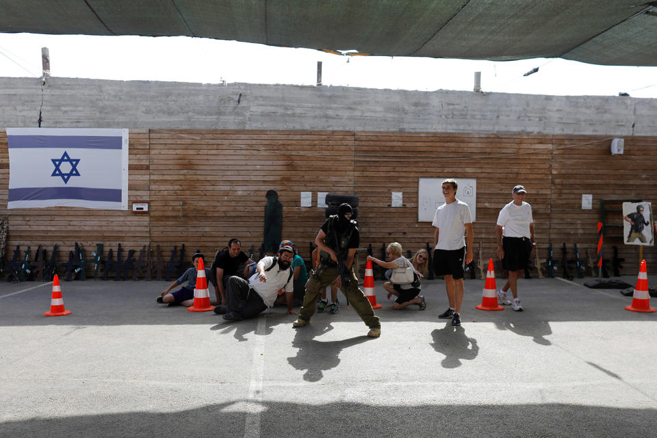 <p>A group of tourists takes part in a two hour “boot camp” experience, at “Caliber 3 Israeli Counter Terror and Security Academy” in the Gush Etzion settlement bloc south of Jerusalem in the occupied West Bank July 13, 2017. (Photo: Nir Elias/Reuters) </p>