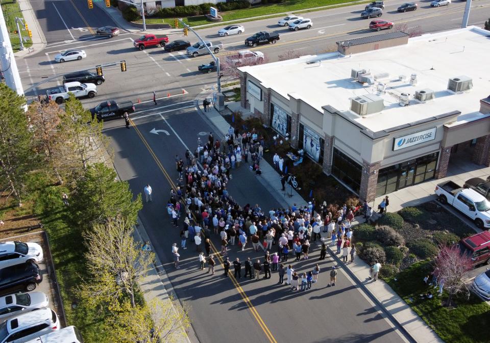 A large group of people gather on Wednesday, April 26, 2023 in West Jordan at 9000 South and 1510 West where 13-year-old Eli Mitchell was killed by a drunk driver one year ago. | Scott G Winterton, Deseret News