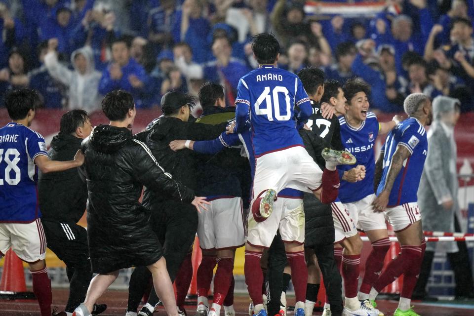 Players of Yokohama F. Marinos celebrate after defeating Ulsan Hyundai after the second leg of the AFC Champions League semifinal soccer match between Yokohama F. Marinos and Ulsan Hyundai in Yokohama, south of Tokyo, Wednesday, April 24, 2024. (AP Photo/Shuji Kajiyama)