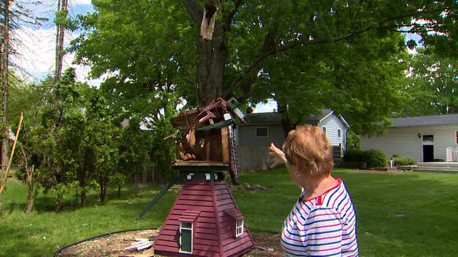 Janet Laurin-Knudsen shows how an outdoor windmill made by her father was damaged in the Portage tornado. (May 13, 2024)