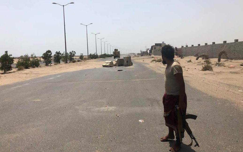 A fighter from the Yemeni pro-government forces backed by the Saudi-led military alliance stands in Hodeida's airport  - AFP