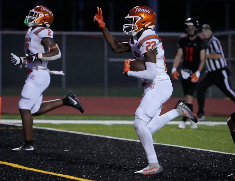 University's Anthony May (22) trots into the end zone for a TD during a game with New Smyrna Beach at New Smyrna Beach Sports Complex, Friday, Sept. 29, 2023.