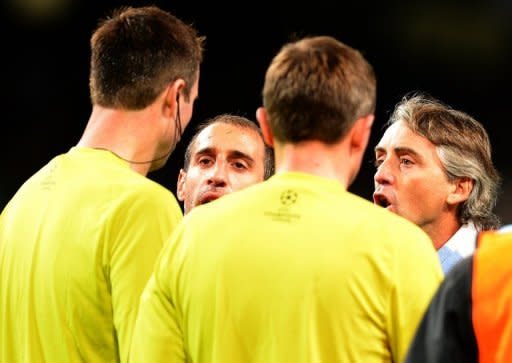 Roberto Mancini confronts the officials after City's Champions League match against Ajax in Manchester on November 6. A 2-2 home draw to Ajax all but ended City's hopes of reaching the Champions League group stages and Mancini's frustration was clear when he confronted the referee