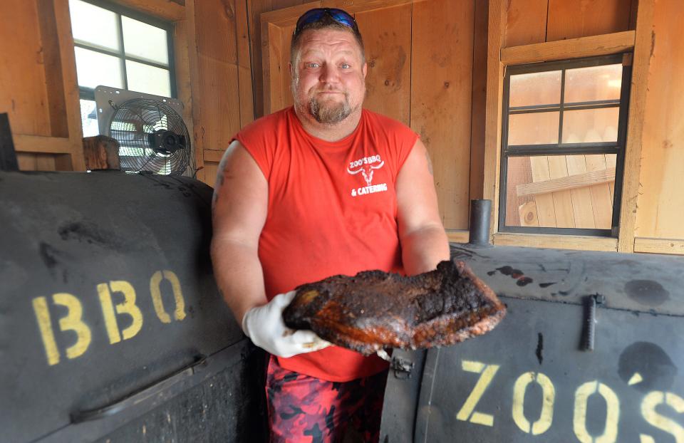 Zoo's BBQ owner Jim Wasielewski, 45, is smoking a brisket in August at his restaurant, 3826 W. 26th St., in Millcreek Township. The restaurant offers ribs, brisket, sausage, pulled pork and chicken.