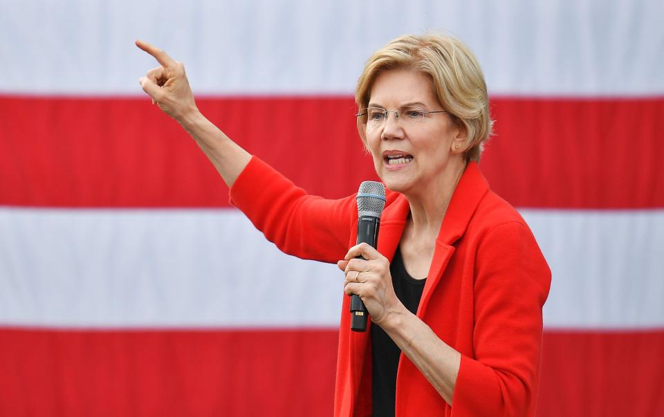 In this file photo taken on May 16, 2019, Democratic presidential candidate Elizabeth Warren speaks during a campaign stop at George Mason University in Fairfax, Virginia. - Warren said on May 30, 2019, that if Donald Trump were not protected by his presidential status, he would be "in handcuffs and indicted" for obstructing the investigation into Russia's 2016 election interference. The progressive US senator from Massachusetts, one of the leading Democrats for the party's 2020 nomination, was the first presidential candidate to speak out in favor of launching impeachment proceedings against Trump.