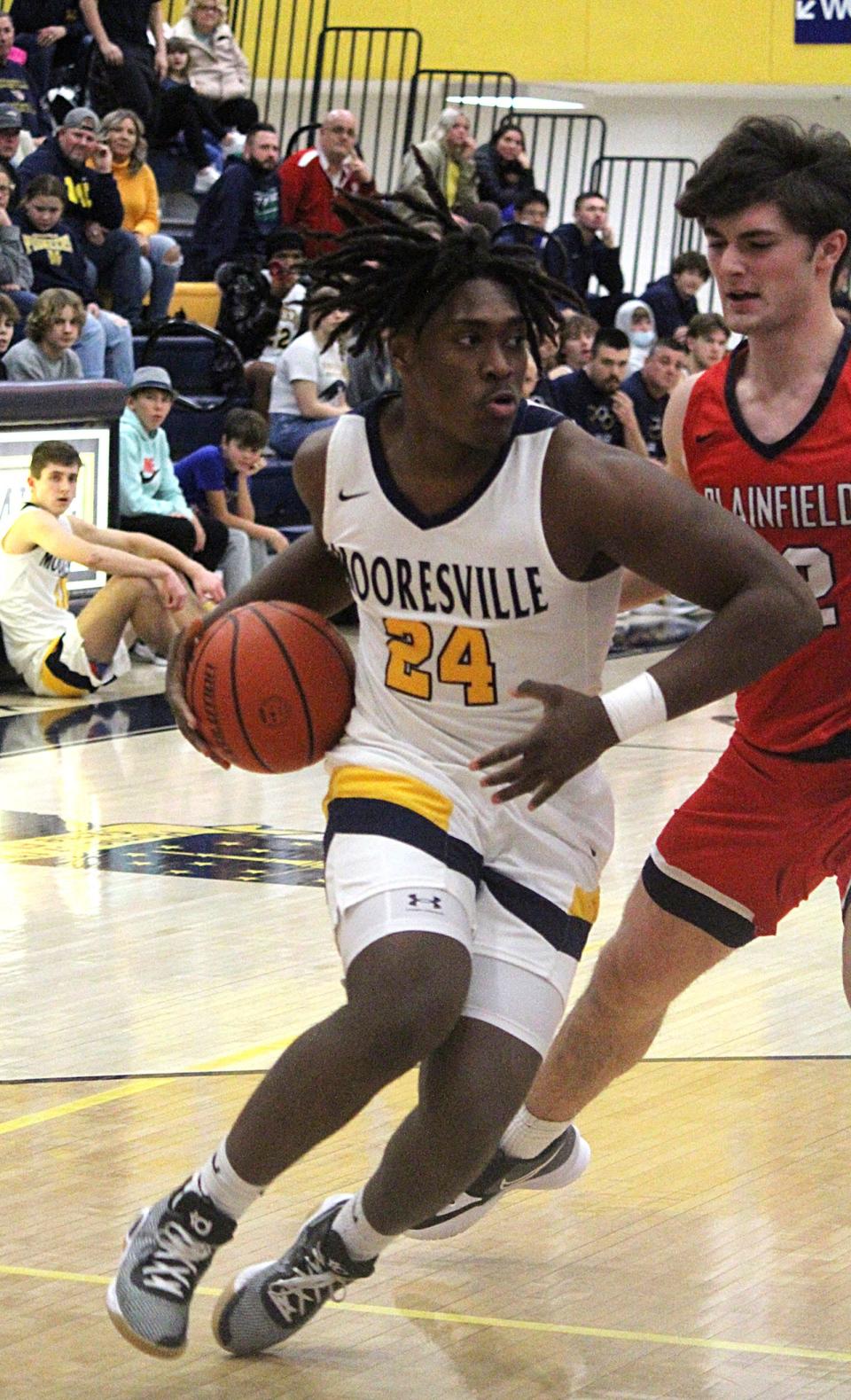 Mooresville junior Nicholas Patterson drives to the basket for two points during Friday's Mid-State Conference game against Plainfield at home. 