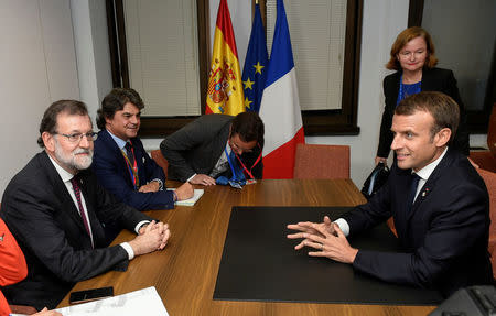 Spain's Prime Minister Mariano Rajoy and French President Emmanuel Macron attend a bilateral meeting during a European Union leaders summit meeting in Brussels, Belgium, October 19, 2017. REUTERS/John Thys/Pool