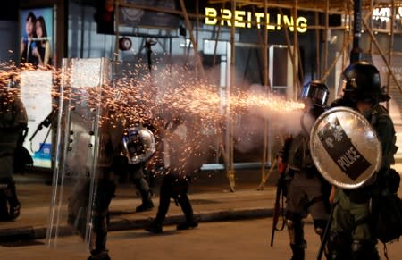 Riot police fire tear gas near Causeway Bay station in Hong Kong