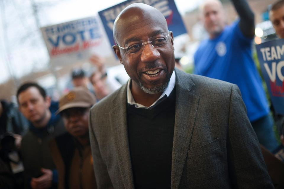 ATLANTA, GEORGIA - DECEMBER 05: Georgia Democratic Senate candidate U.S. Sen. Raphael Warnock (D-GA) speaks at a Get Out the Vote event with members of the Teamsters at a UPS worksite December 5, 2022 in Atlanta, Georgia. Sen. Warnock continues to campaign throughout Georgia for the runoff election tomorrow against his Republican challenger Herschel Walker. (Photo by Win McNamee/Getty Images)