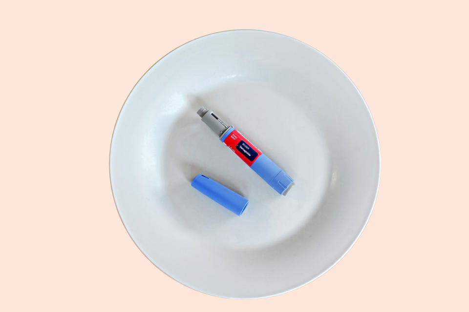 Semaglutide injecting  pen with lid on a white plate. Ozempic is a Type 2 diabetes treatment recently trending for its potential impact on weight loss. (Getty Images)