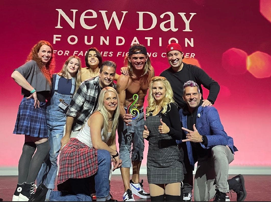 County Executive Mark Hackel, top row center, poses with other performers at a New Day Foundation Celebrity Lip Sync Battle at Sound Board at MotorCity Casino in Detroit last November.