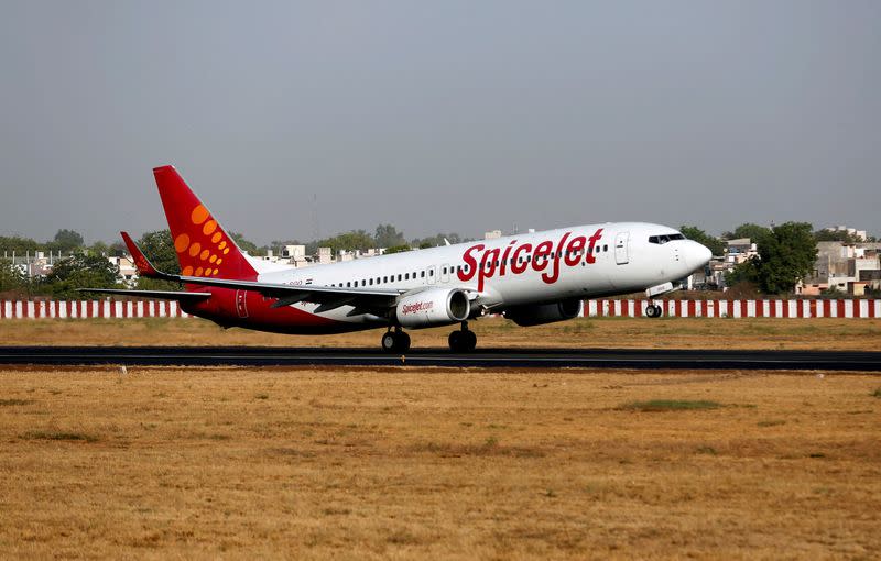 FILE PHOTO: A SpiceJet Boeing 737 passenger aircraft takes off from Sardar Vallabhbhai Patel international airport in Ahmedabad