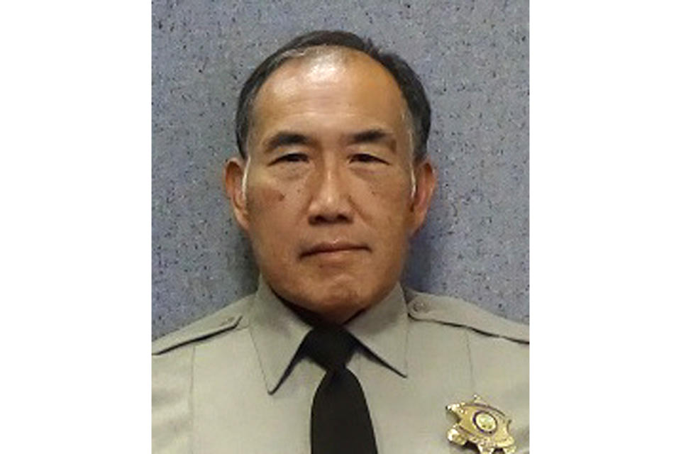 In this undated photo released by the Maricopa County Sheriff's Office is Officer Gene Lee. Authorities say Lee, a Phoenix area jail officer who was comatose after being attacked by an inmate has died. Maricopa County Sheriff Paul Penzone said 59-year-old Daniel Davitt attacked Officer Gene Lee without provocation Tuesday, Oct. 29, 2019. He said Lee was grabbed by the throat from behind and knocked to the ground. Penzone said Lee's head hit the cement floor and he never regained consciousness. Davitt faces sex crime charges involving children and is representing himself. (Maricopa County Sheriff's Office via AP)