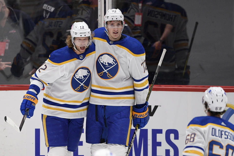 Buffalo Sabres center Eric Staal (12) celebrates his goal with right wing Tage Thompson (72) and left wing Victor Olofsson (68) during the first period of an NHL hockey game against the Washington Capitals, Friday, Jan. 22, 2021, in Washington. (AP Photo/Nick Wass)