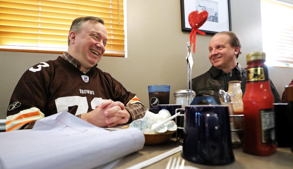 The Beacon Journal’s Joe Thomas, left, and Mark Price trade tales about what it's like to have the same name as a Cleveland sports star.