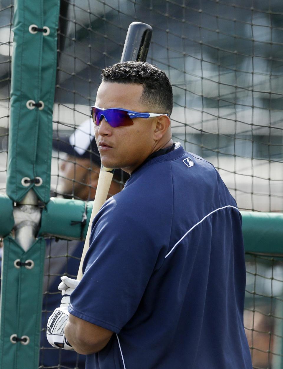 Detroit Tigers first baseman Miguel Cabrera prepares for batting practice before a spring exhibition baseball game against the Tampa Bay Rays in Lakeland, Fla., Friday, March 28, 2014. (AP Photo/Carlos Osorio)