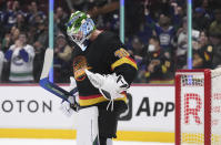 Vancouver Canucks goalie Spencer Martin celebrates after the team's 5-2 win over the Seattle Kraken during an NHL hockey game Tuesday, April 26, 2022, in Vancouver, British Columbia. (Darryl Dyck/The Canadian Press via AP)