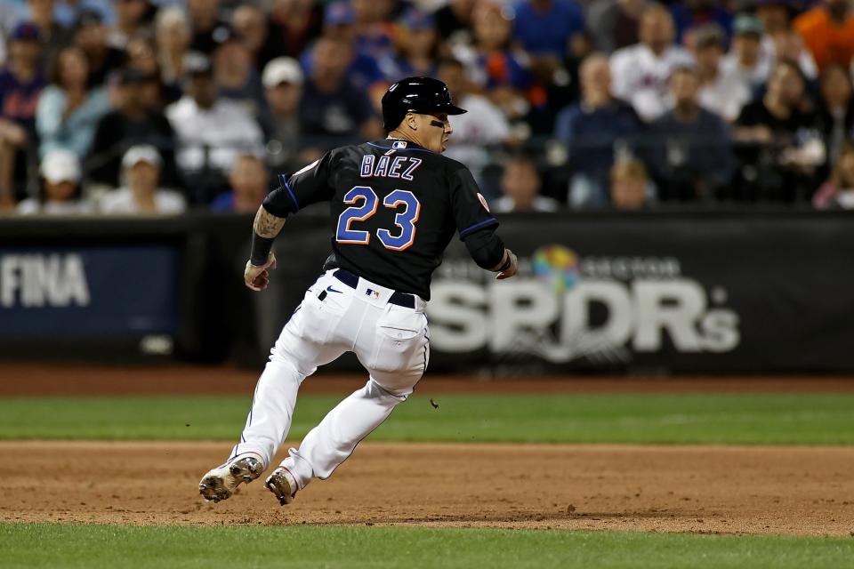 New York Mets' Javier Baez gets caught in a rundown by the New York Yankees during the third inning of a baseball game on Friday, Sept. 10, 2021, in New York. (AP Photo/Adam Hunger)