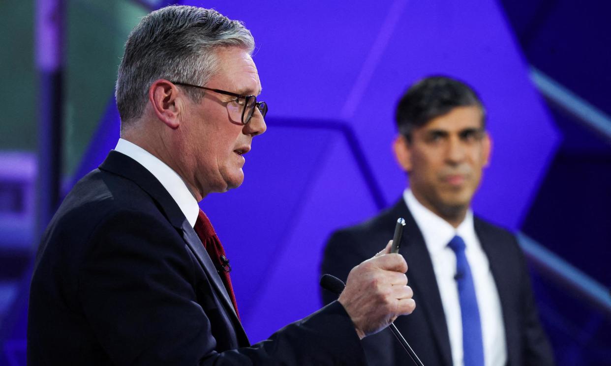 <span>Keir Starmer and Rishi Sunak during the last live TV debate of the election campaign, at Nottingham Trent University on 26 June.</span><span>Photograph: Phil Noble/AFP/Getty Images</span>