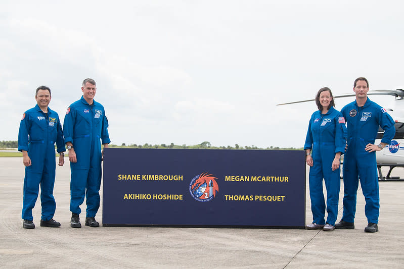 From left to right, Japan Aerospace Exploration Agency astronaut Akihiko Hoshide, NASA astronauts Shane Kimbrough and Megan McArthur, and European Space Agency astronaut Thomas Pesquet pose for a photo after arriving at the Launch and Landing Facility at NASA’s Kennedy Space Center on April 16, 2021. The quartet will go to the space station on SpaceX’s Crew-2 mission, which is scheduled to launch on April 22.