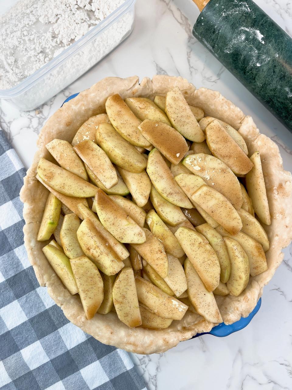 Use a deep dish pie pan so you can fit in even more apples.