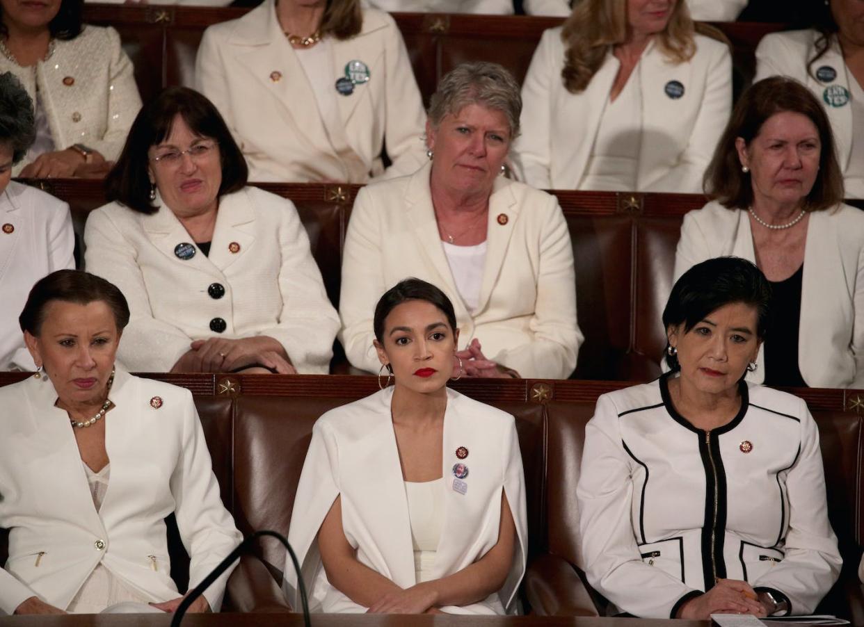 U.S. Rep. Alexandria Ocasio-Cortez watches Donald Trump's state of the union address in 2019 with other female Democratic lawmakers. <a href="https://media.gettyimages.com/id/1094213922/photo/president-trump-delivers-state-of-the-union-address-to-joint-session-of-congress.jpg?s=612x612&w=gi&k=20&c=E6iTKHxvvJYvtDBBreDHwQR-CpByT0YndSB-5VI86q4=" rel="nofollow noopener" target="_blank" data-ylk="slk:Alex Wong/Getty Images;elm:context_link;itc:0;sec:content-canvas" class="link ">Alex Wong/Getty Images </a>