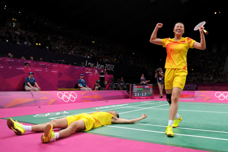 LONDON, ENGLAND - AUGUST 03: Nan Zhang (L) and Yunlei Zhao of China celebrate winning the Mixed Doubles Badminton Gold Medal match against compatriots Chen Xu and Jin Ma of China on Day 7 of the London 2012 Olympic Games at Wembley Arena on August 3, 2012 in London, England. (Photo by Michael Regan/Getty Images)