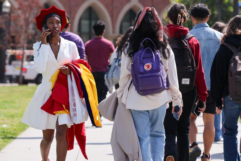 Los Angeles, CA - May 08: Graduate Kayla Love on her way to receive her PhD in biochemistry in a pared down ceremonies at the University of Southern California on Wednesday, May 8, 2024 in Los Angeles, CA. (Brian van der Brug / Los Angeles Times)