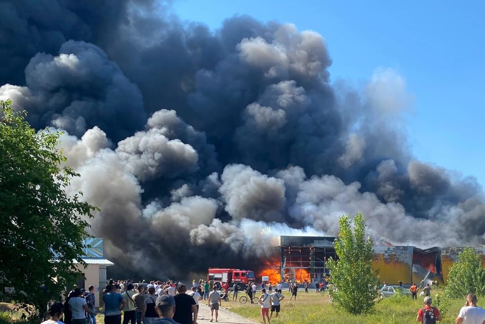 Smoke billows from a crowded shopping mall in Kremenchuk, Ukraine, June 27, 2022. Two days after the airstrike, Two days after the attack, the death toll had reached 20. "The number of victims is impossible to imagine," Ukraine’s President Volodymyr Zelenskyy said on Telegram.