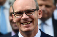 FILE PHOTO: Ireland's Minister for Housing, Planning, Community and Local Government Simon Coveney poses outside the Fine Gael headquarters in Dublin, Ireland May 18, 2017. REUTERS/Clodagh Kilcoyne/File Photo