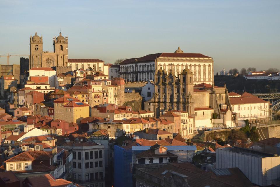 This Feb. 16, 2017 photo shows Porto, Portugal, from the Vitoria lookout point. Spectacular sunsets are a major tourist attraction and places to view them are labeled on maps as miradouros. (Albert Stumm via AP)