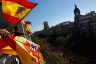 <p>People wave Spanish flags from a balcony during a mass rally against Catalonia’s declaration of independence, inÂ Barcelona, Spain, Sunday, Oct. 29, 2017. (Photo: Gonzalo Arroyo/AP) </p>
