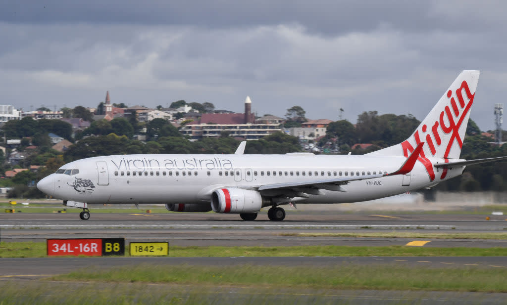 A Virgin Australia Boeing 737-800 series aircraft on the runway at Sydney's main international airport, Kingsford Smith, on March 15, 2020 in Sydney, Australia.