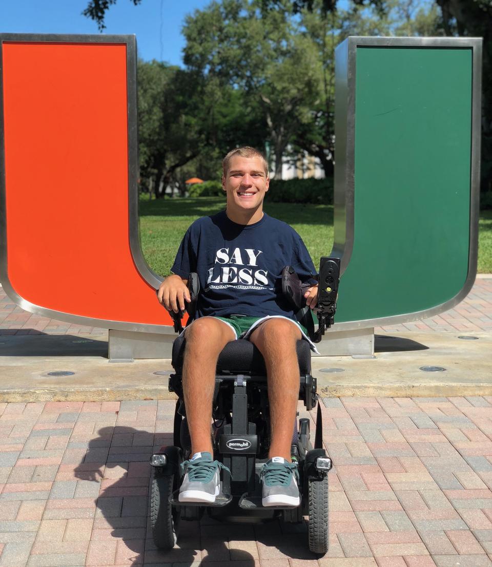 North East native Ian Malesiewski, a Cathedral Prep grad, poses in front of the University of Miami logo in this 2019 photo. Malesiewski, who suffered a severe spinal cord injury in 2016, will graduate from Miami in May with a bachelor's degree in neuroscience and minors in chemistry, philosophy and public health. He will then attend Harvard Law School.