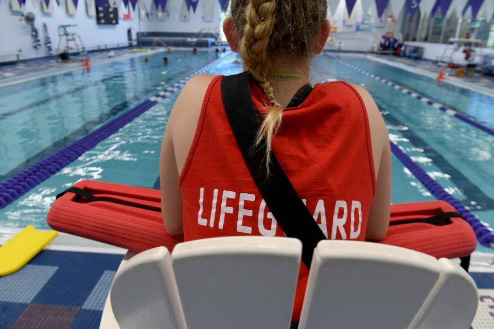 Lifeguard Grace Reed watches over the pool at Paul and Carol David YMCA of Jackson Township. Many pools are facing a shortage of lifeguards.