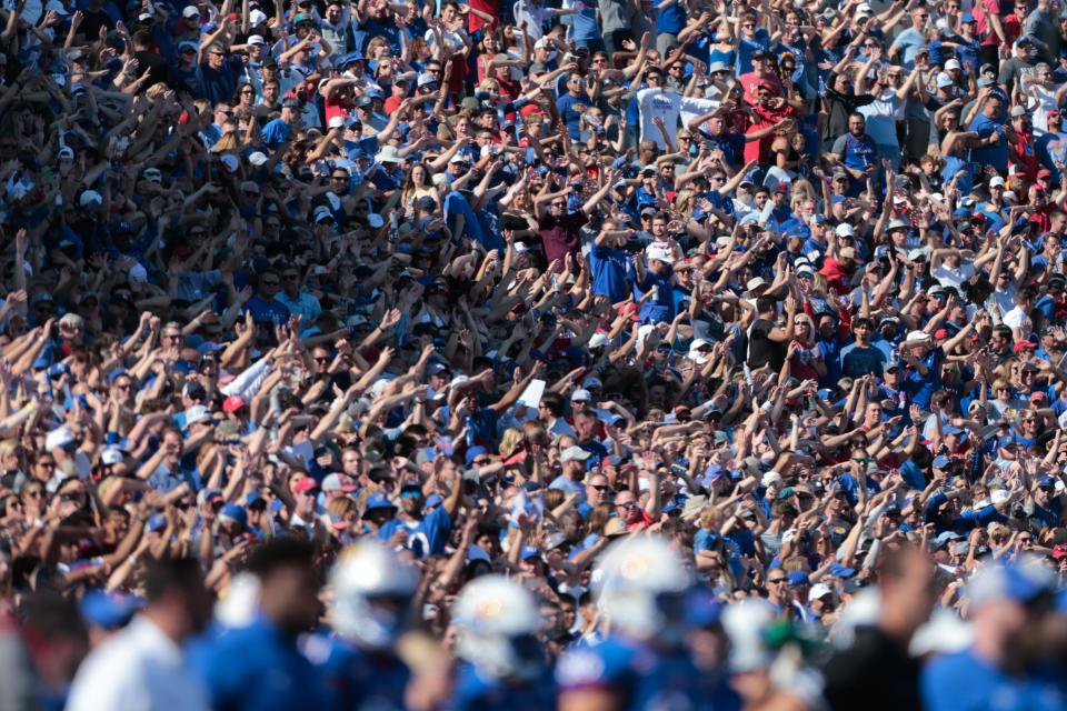 Kansas fans "wave the wheat" after a touchdown against Iowa State Saturday at David Booth Kansas Memorial Stadium.