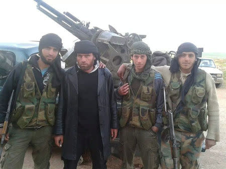 Fouad al-Ghraibi is seen (2ndL) with fighters in this undated photo in Idlib, Syria. REUTERS/Stringer