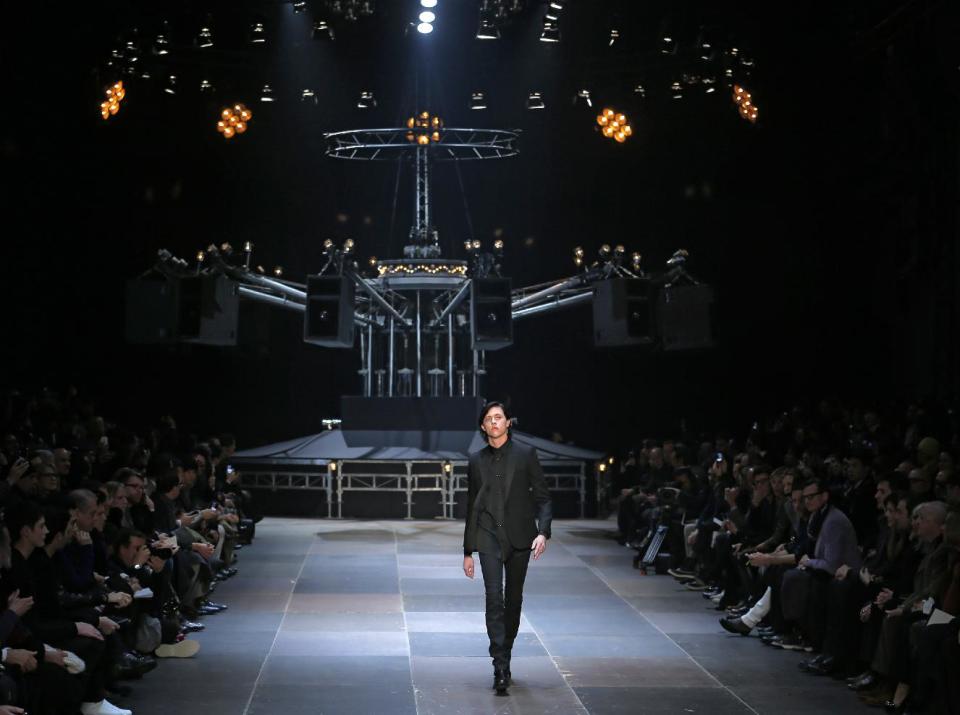 A model wears a creation by Born French fashion designer Hedi Slimane for St Laurent as part of the Men's fall-winter 2013-2014 fashion collection presented in Paris, Sunday , Jan. 20 2013 (AP Photo/ Jacques Brinon)