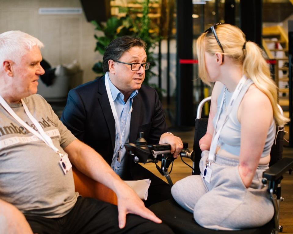 Paul Hudson (C) and Sanofi athlete, Ellie Challis at Sanofi office in Paris.