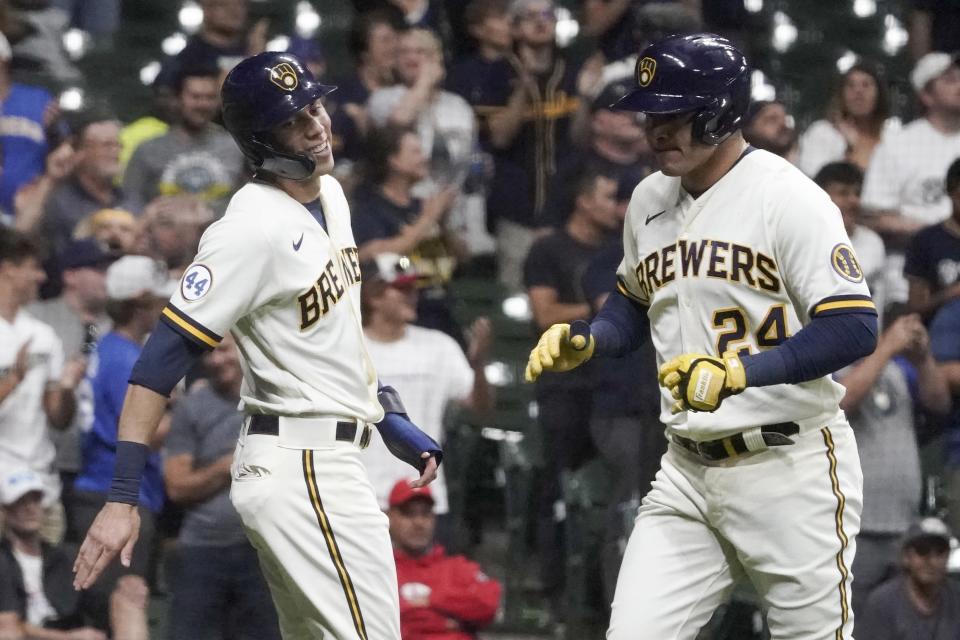 Milwaukee Brewers' Avisail Garcia is congratulated by Christian Yelich after hitting a two-run home run during the seventh inning of a baseball game against the Philadelphia Phillies Tuesday, Sept. 7, 2021, in Milwaukee. (AP Photo/Morry Gash)