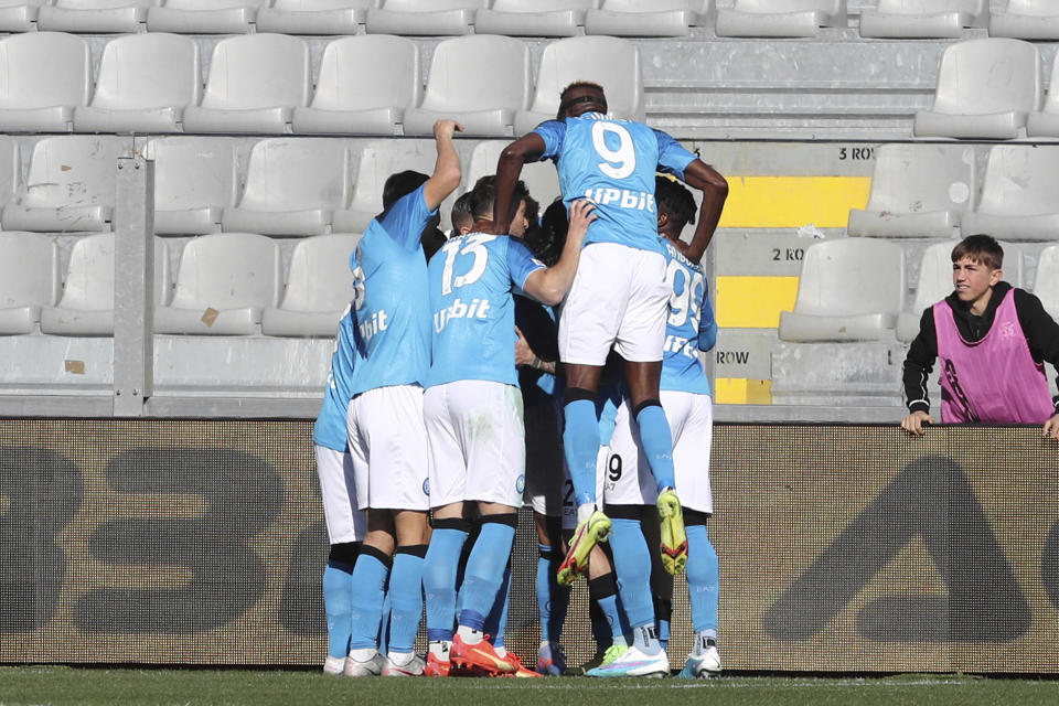 Napoli players celebrate with Napoli's Kvaratskhelia after he scored to 0-1 during the Serie A soccer match between Spezia Calcio and SSC Napoli at the Alberto Picco stadium in La Spezia, Italy, Sunday Feb. 5, 2023. (Tano Pecoraro/LaPresse via AP)