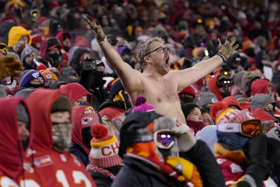 A fan not wearing a shirt gestures during the first half of an NFL wild-card playoff football game between the Kansas City Chiefs and the Miami Dolphins on Saturday, Jan. 13, 2024, in Kansas City, Mo. (AP Photo/Ed Zurga)